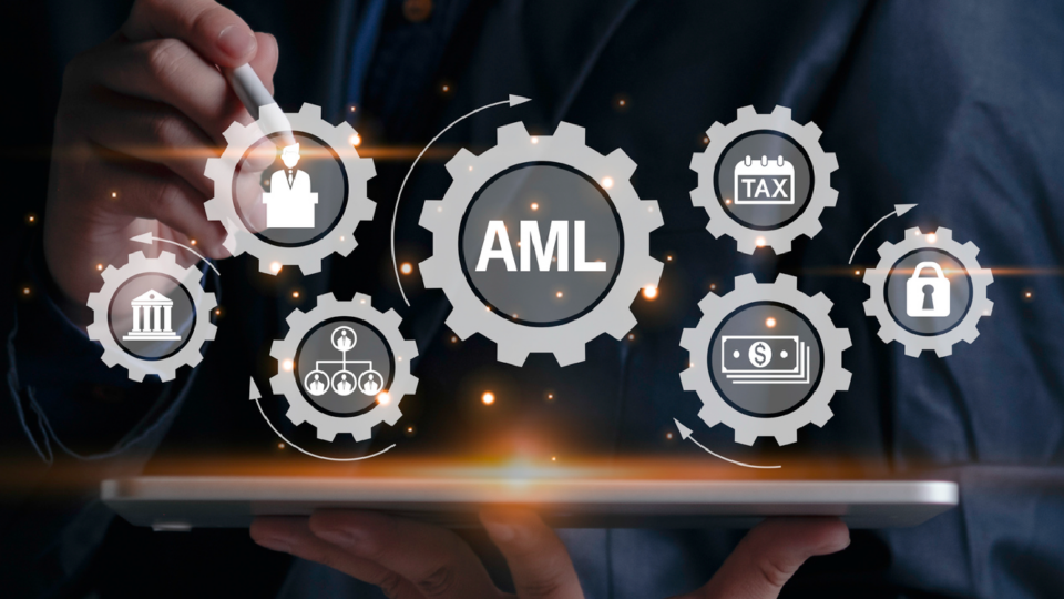 Someone with tablet with virtual wheel cogs above with various icons including AML.